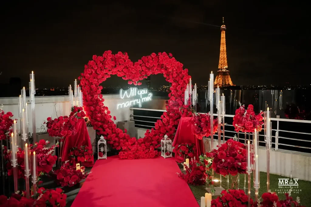 Eiffel Tower proposal setup with flowers and candles