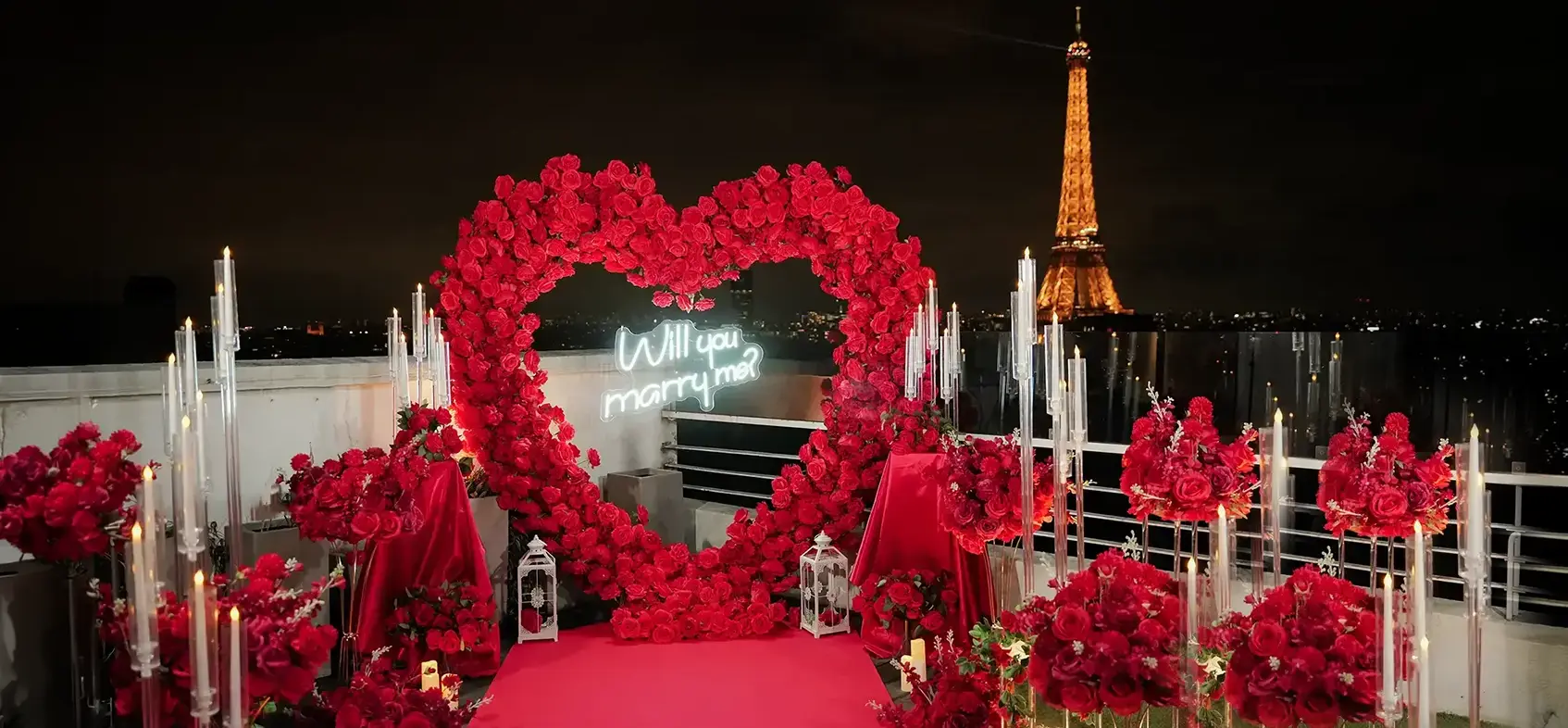 paris proposal package with flowers and candles